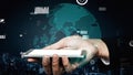 Hand Holding Smartphone with Digital World Map and Data Visualization Elements against Dark Urban Background xenic Royalty Free Stock Photo