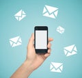 Hand holding smartphone with email symbol Royalty Free Stock Photo