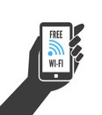 Hand holding smartphone with free wifi
