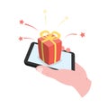 Hand holding smartphone with gift box on the screen