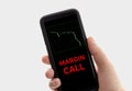 Hand holding a smartphone with the message margin call