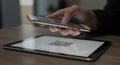 Mobile Payment: Hand Scanning QR Code on Tablet Royalty Free Stock Photo