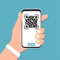 Hand holding smartphone with QR code in a flat design