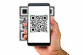 Hand holding smartphone scanning QR code on white background