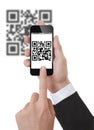 Hand Holding a Smartphone scanning qrcode Royalty Free Stock Photo