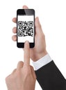 Hand Holding a Smartphone scanning qrcode Royalty Free Stock Photo