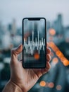 Modern Technology Meets Urban Rhythm With a Hand Holding a Smartphone Displaying an Audio Waveform Against a City Royalty Free Stock Photo