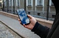 Hand Holding Smartphone Sky Reflection On Street Royalty Free Stock Photo