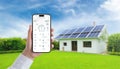 Hand holding smartphone with smart home app, monitoring solar panel energy, temperature, and home consumption