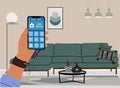 Hand with Smart home app on phone, interior scene.