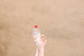 Hand holding smashed empty plastic bottle isolated on a blurred background. Recycle and volunteer concept. Environmental pollution Royalty Free Stock Photo