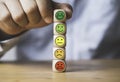 Ã Â¹â¡Hand holding smile face icon stacking on top of different mood face for select positive mindset concept