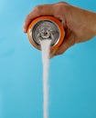 Can pouring sugar stream in calories content of soda energetic and refreshing drinks Royalty Free Stock Photo