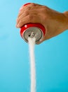 Can pouring sugar stream in calories content of soda energetic and refreshing drinks Royalty Free Stock Photo