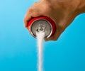 Can pouring sugar stream in calories content of soda energetic and refreshing drinks Royalty Free Stock Photo