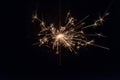 hand holding a sparkler fire on black background Royalty Free Stock Photo