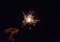 hand holding a sparkler fire on black background Royalty Free Stock Photo