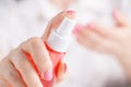 Hand holding spay bottle Royalty Free Stock Photo