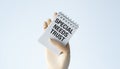 A hand holding a spiral bound notebook with the words Special Needs Trust writ Royalty Free Stock Photo