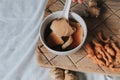 Hand holding spoon eating homemade soy custard in hot ginger syrup eat with with deep fried powder pastry good for health