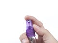 Hand holding a spray Royalty Free Stock Photo