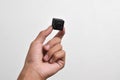 Hand holding a spy camera, Black security camera Royalty Free Stock Photo
