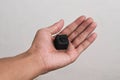Hand holding a spy camera, Black security camera Royalty Free Stock Photo