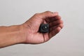 Hand holding a spy camera, Black security camera Royalty Free Stock Photo