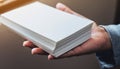 Hand Holding Stack of Blank White Paper Sheets Royalty Free Stock Photo