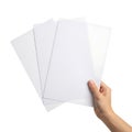 Hand holding a stack of blank white paper sheets with dotted lines Royalty Free Stock Photo