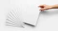 Hand holding stack of blank white paper sheets Royalty Free Stock Photo