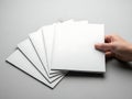 Hand holding stack of blank white paper sheets Royalty Free Stock Photo