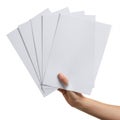 Hand holding a stack of light gray paper sheets Royalty Free Stock Photo