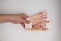 Hand holding stack of russian roubles. Russia money five thousand banknote hold in hands