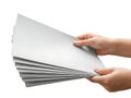 Hand holding a stack of white paper sheets Royalty Free Stock Photo