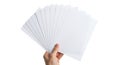 Hand holding stack of white paper sheets for creative projects and presentations Royalty Free Stock Photo