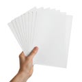 Hand holding stack of white paper sheets Royalty Free Stock Photo