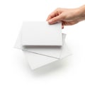 Hand holding a stack of white paper sheets Royalty Free Stock Photo
