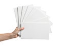 Hand holding a stack of white printer paper Royalty Free Stock Photo