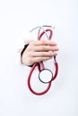 Hand holding stethoscope