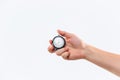 Hand holding a stopwatch against a white background Royalty Free Stock Photo