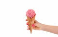 Hand holding strawberry ice cream cone on white background Royalty Free Stock Photo