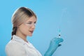 Woman`s hand holding syringe and medicine vial prepare for injection in operating room. Space for text Royalty Free Stock Photo