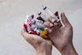 Hand holding syringe and toilet paper that is ink stained. Royalty Free Stock Photo