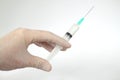 Hand holding syringe and vaccine. Injection syringe isolated. Royalty Free Stock Photo