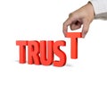 Hand holding T and putting Trust word together Royalty Free Stock Photo