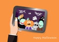 Hand holding tablet, Halloween party concept, enjoy and party, flat design idea, greeting card cartoon vector