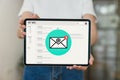 Hand holding tablet and show email screen on application mobile in the office.