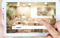 Hand holding tablet with www. word on search bar over blur resta Royalty Free Stock Photo