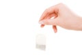 Hand holding tea bag Royalty Free Stock Photo